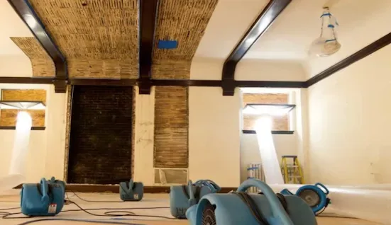 Water damage drying equipment in flooded basement